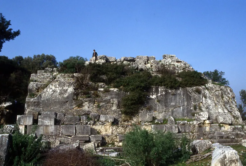 East face of the mausoleum; the base with a figure in front of it showing human scale